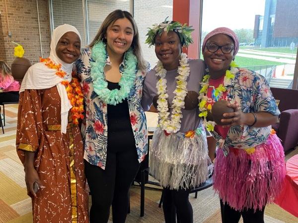 A group of women wearing colorful dresses